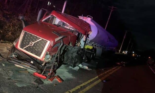 Police are looking for answers in a deadly head-on collision that entrapped a trucker.