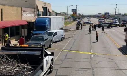 VIDEO: During a medical emergency, a trucker plows into parked vehicles and almost hits a barbershop.