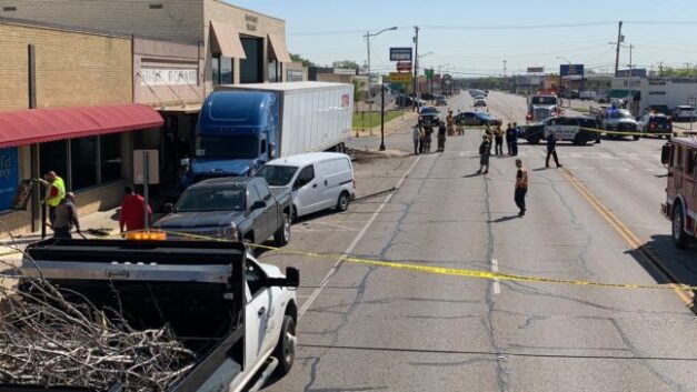 VIDEO: During a medical emergency, a trucker plows into parked vehicles and almost hits a barbershop.