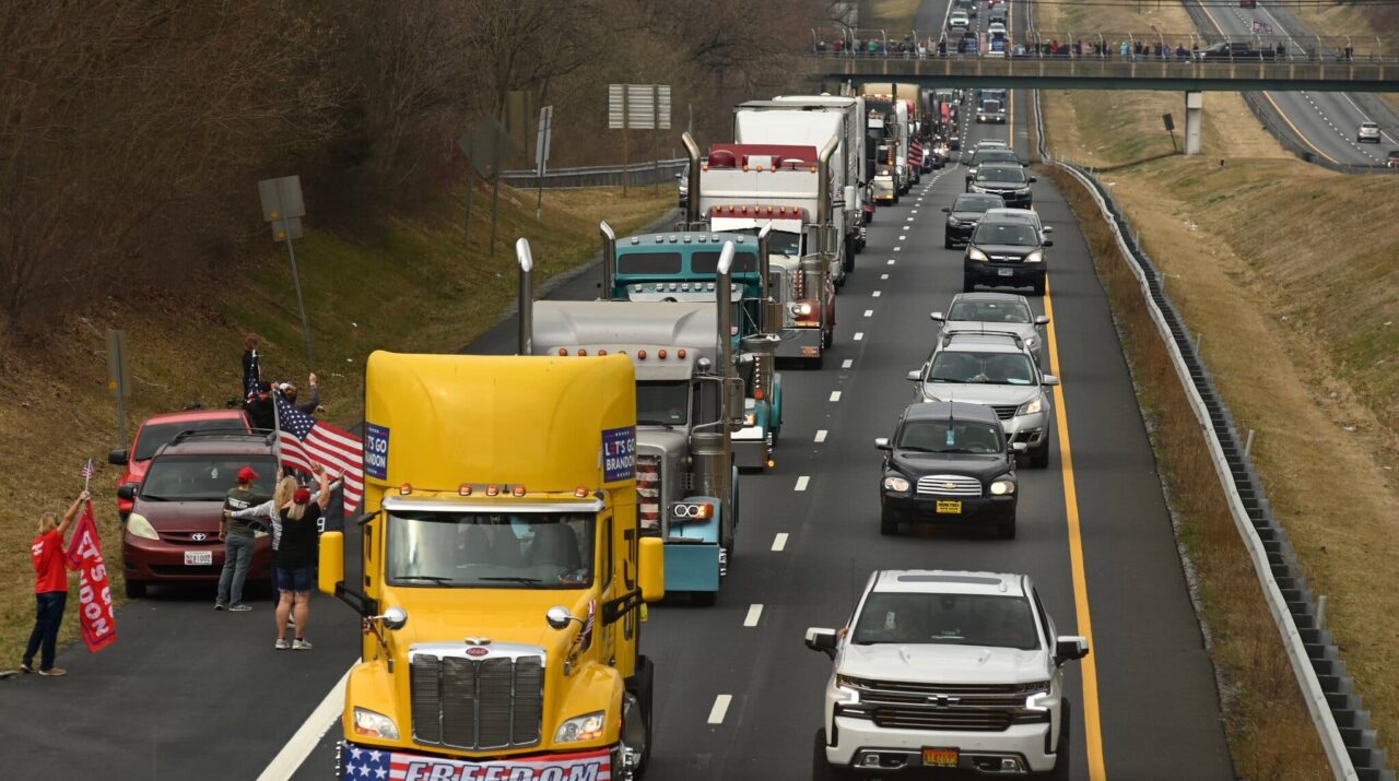 Hundreds of vehicles protesting Covid mandates surround Washington, led by truckers.