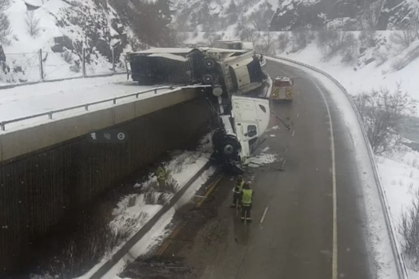 I-70 was closed after a semi-truck was hanging off the road!